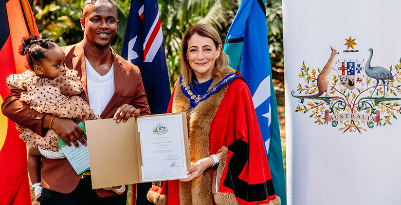 Mayor Jenny Hill welcomes new Australian citizen Ibrahim Masumbuko at Council's citizenship ceremony at the Palmetum.