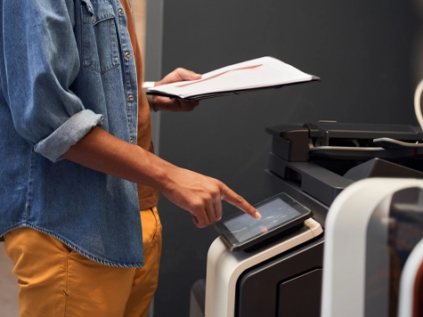 Using the printer to photocopy at the library