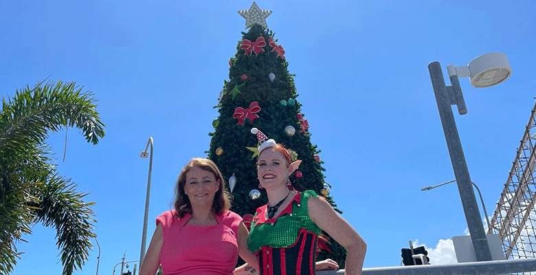 Townsville Mayor Jenny Hill and roving entertainer Kara Enigma feel the Christmas spirit ahead of Christmas in the City.