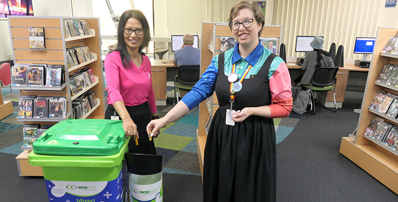 Townsville City Council customer service officer Etha Aldridge and local history librarian Katie Pittock show off the B-cycle drop-off points at Citylibraries Flinders Street.