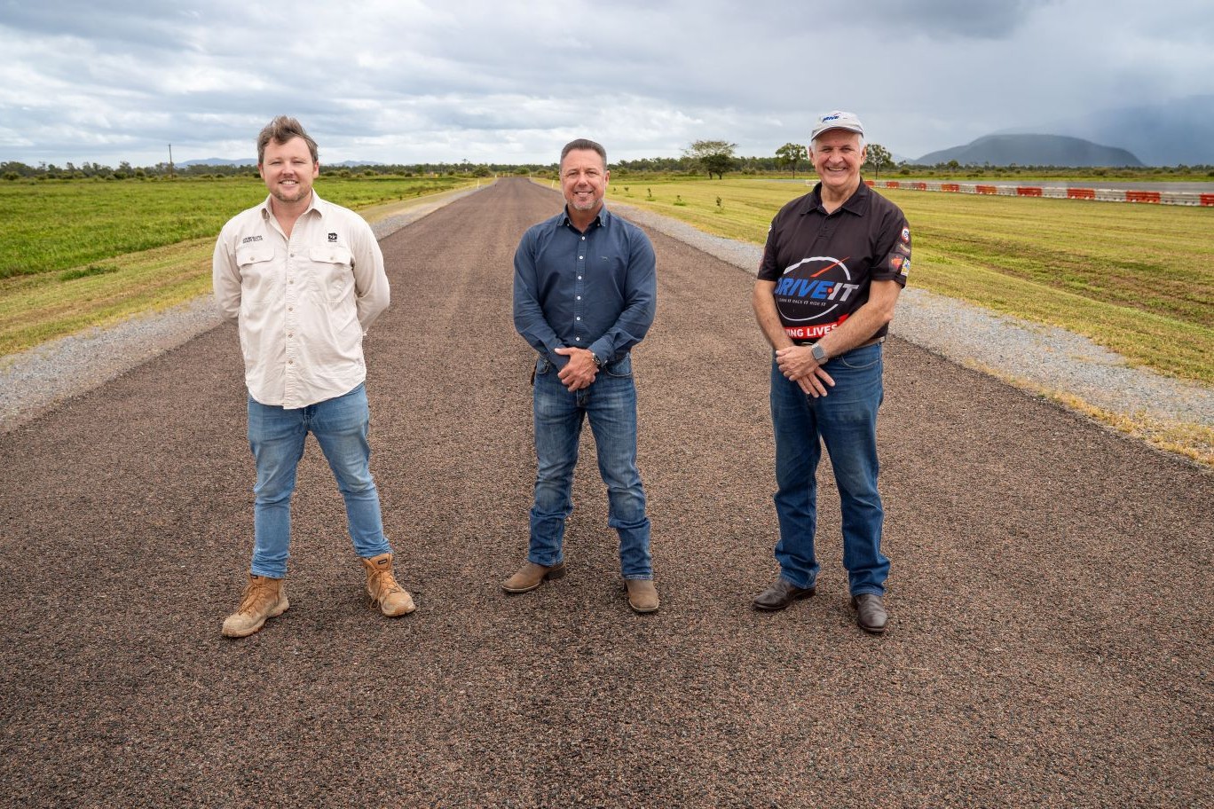 Division 10 Councillor Brady Ellis, Mayor Nick Dametto and DriveIt NQ CEO Pat Driscoll on the recently completed access road to the facility.