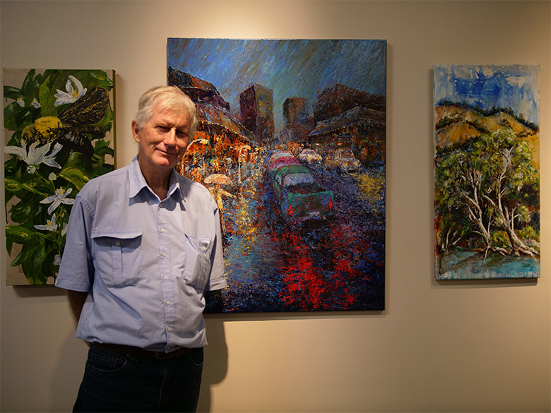 Townsville Art Society president Patrick Lowth with his artwork It’s Wet Weather Again
