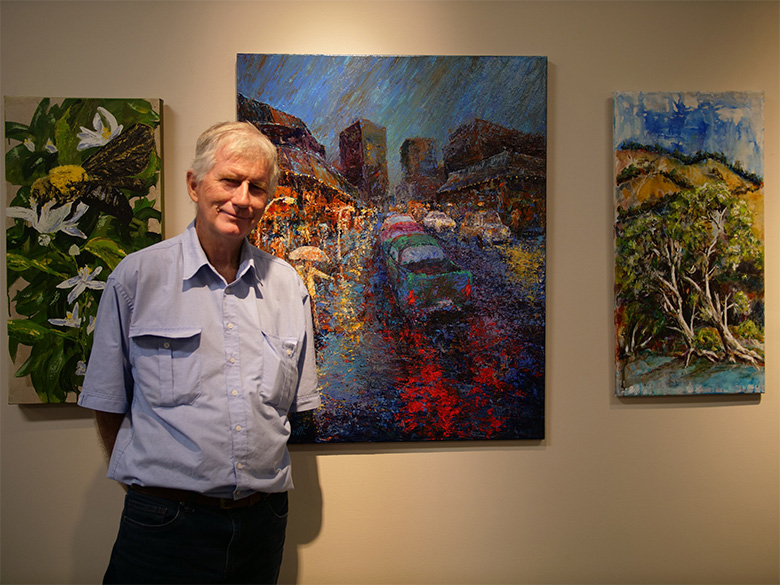 Caption: Townsville Art Society president Patrick Lowth with his artwork It’s Wet Weather Again Townsville Art Society president Patrick Lowth with his artwork It’s Wet Weather Again