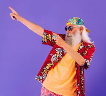A man wearing sunglasses and a tropical shirt pointing up at the top left