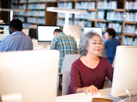 Visitors using computers at the library