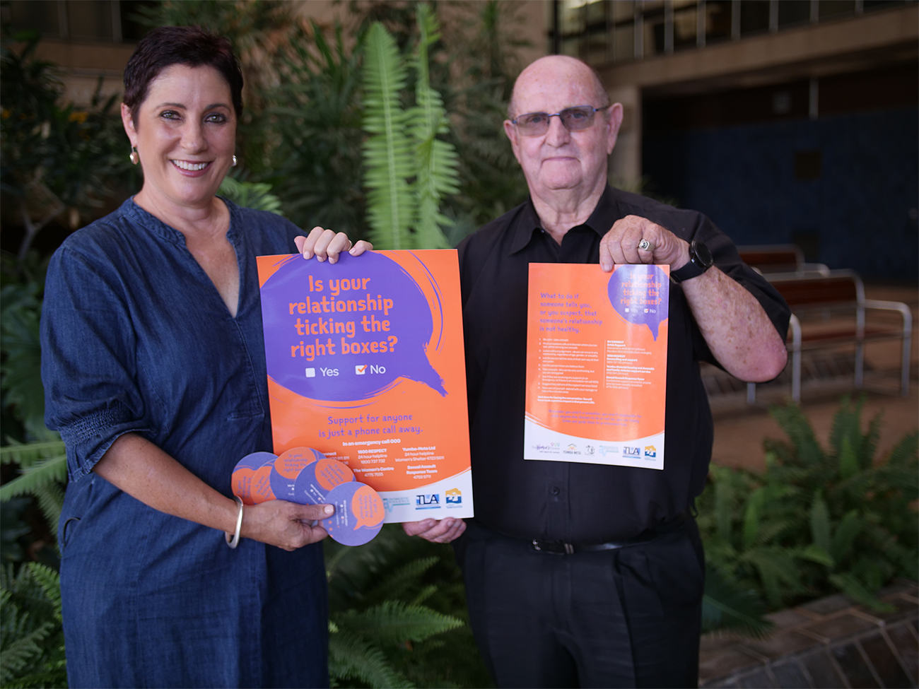Caption: Cr Ann-Maree Greaney and Townsville Liquor Accord chairperson Arthur McMahon with the new anti-DFV initiative's coasters and posters. 