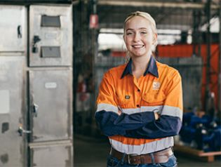 A Council worker smiling while at a depot