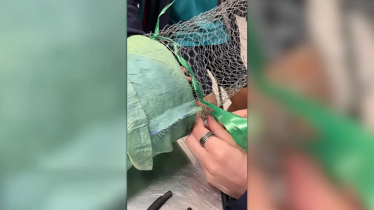 Student constructing artwork