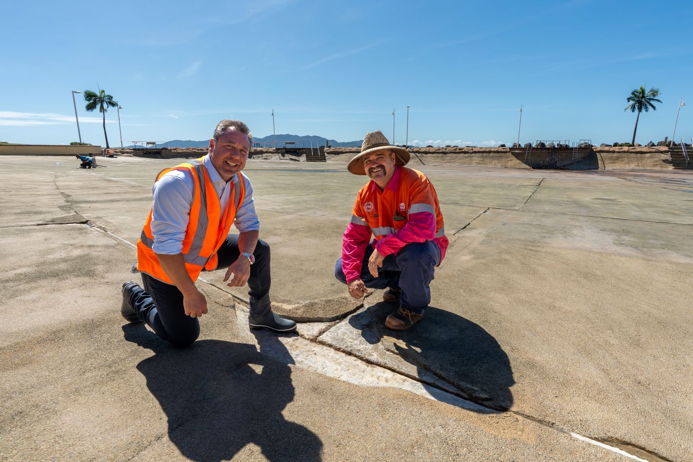 Mayor Nick Dametto and TCC's Maintenance Team Leader Shane Cullen inspecting one of the cracks to be repaired.