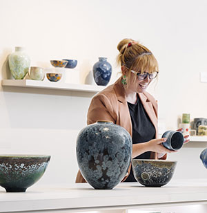 A visitor browsing gifts at the gallery shop.