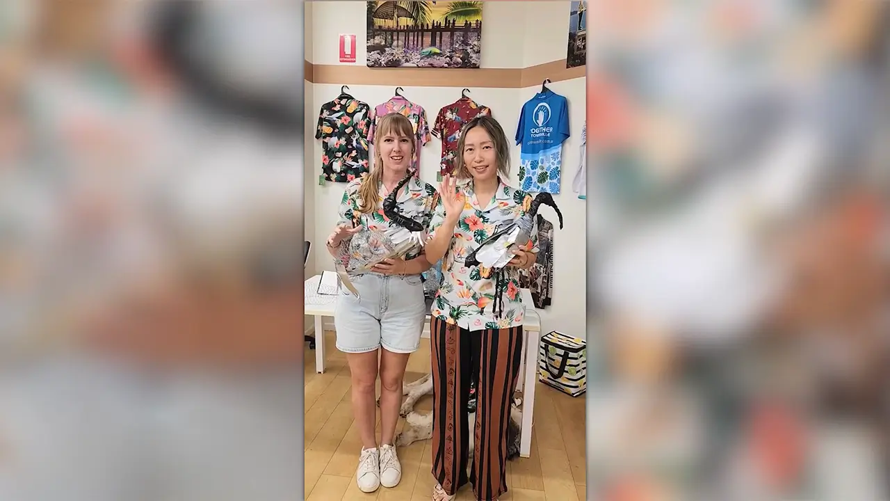 Jacqueline Burchell and Dahé Wie holding Bin Chickens