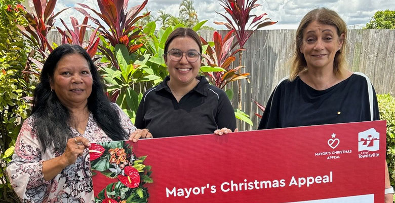 Yumba Meta's Brenda Lucas and Taleah Watson accept a $20,000 cheque from Townsville Mayor Jenny Hill