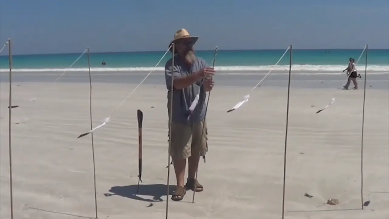 Simon Poole installing his artwork