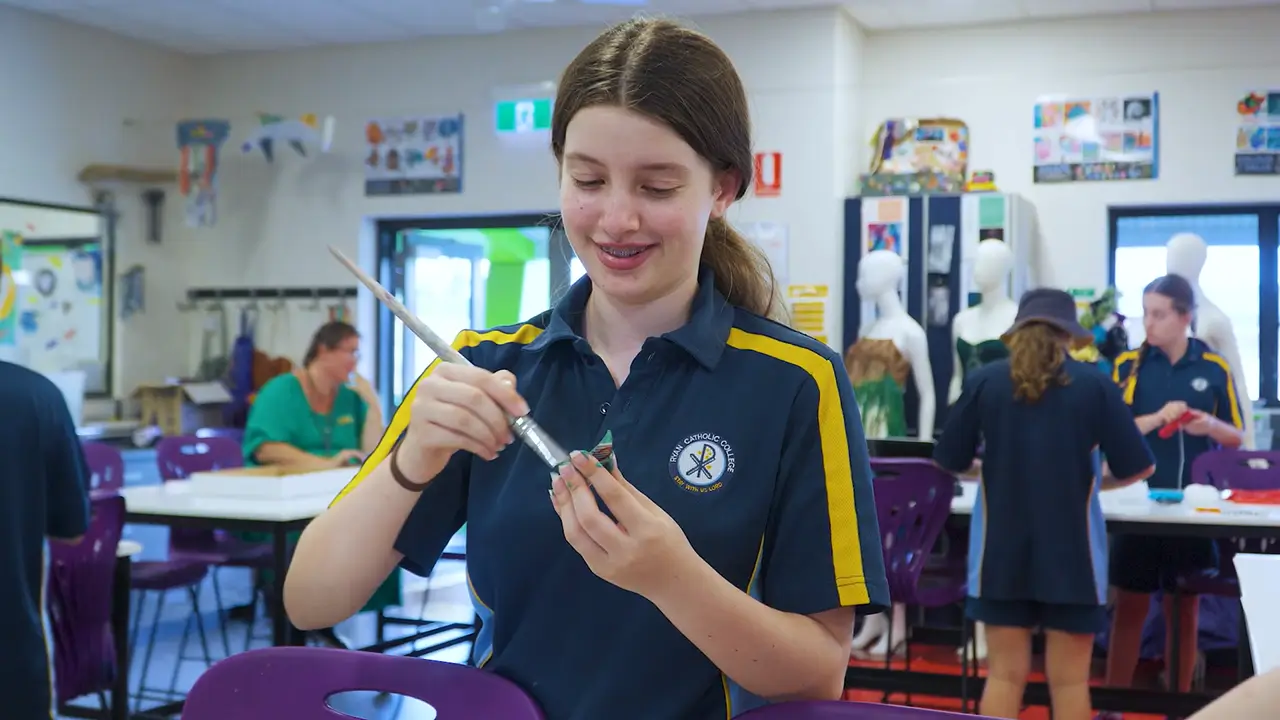 Student creating artwork