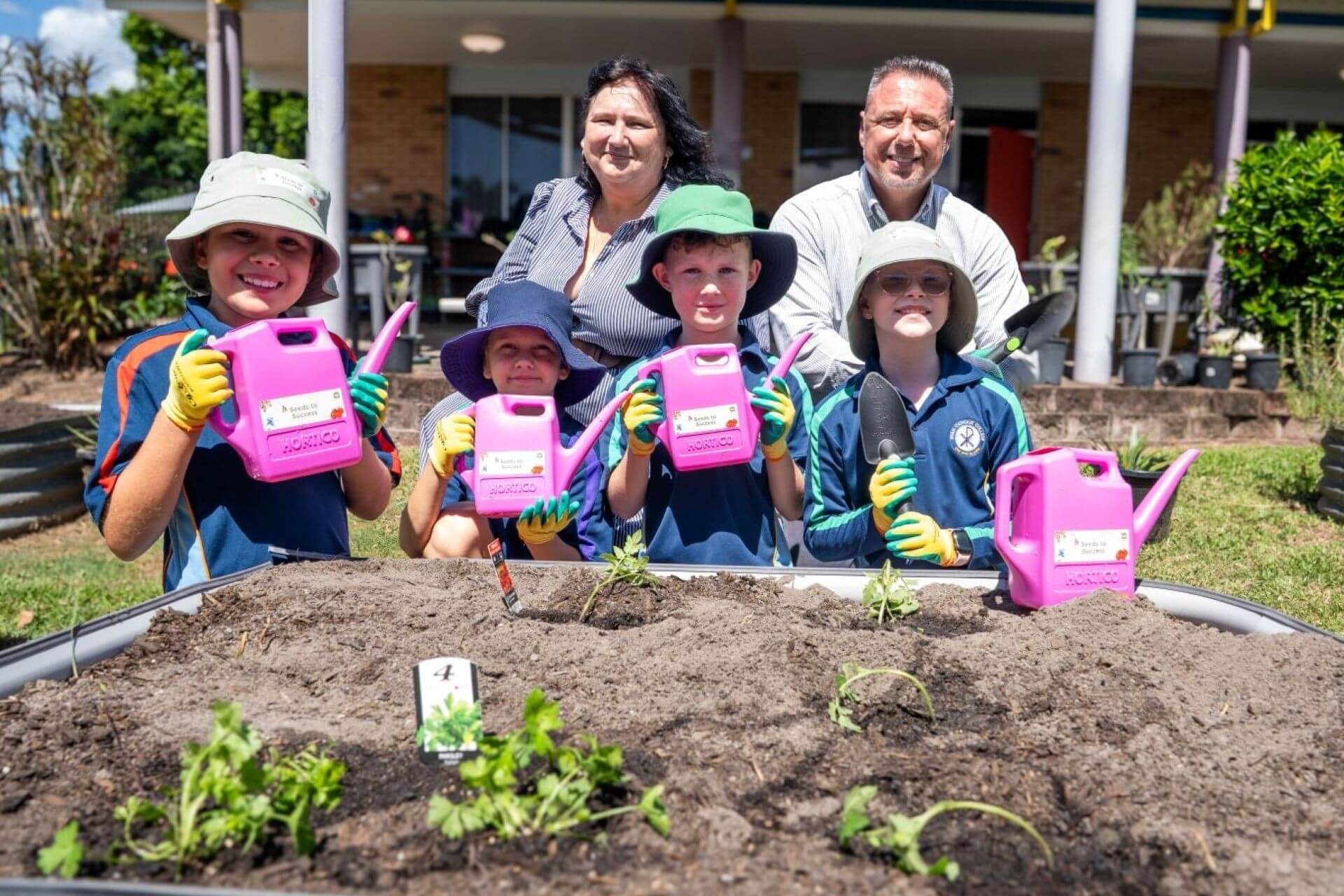 Cr Dirou and Mayor Nick Dametto with Year 4 Ryan Catholic College Students (L-R) Sienna, Darcy, Lachlan and Mackenzie