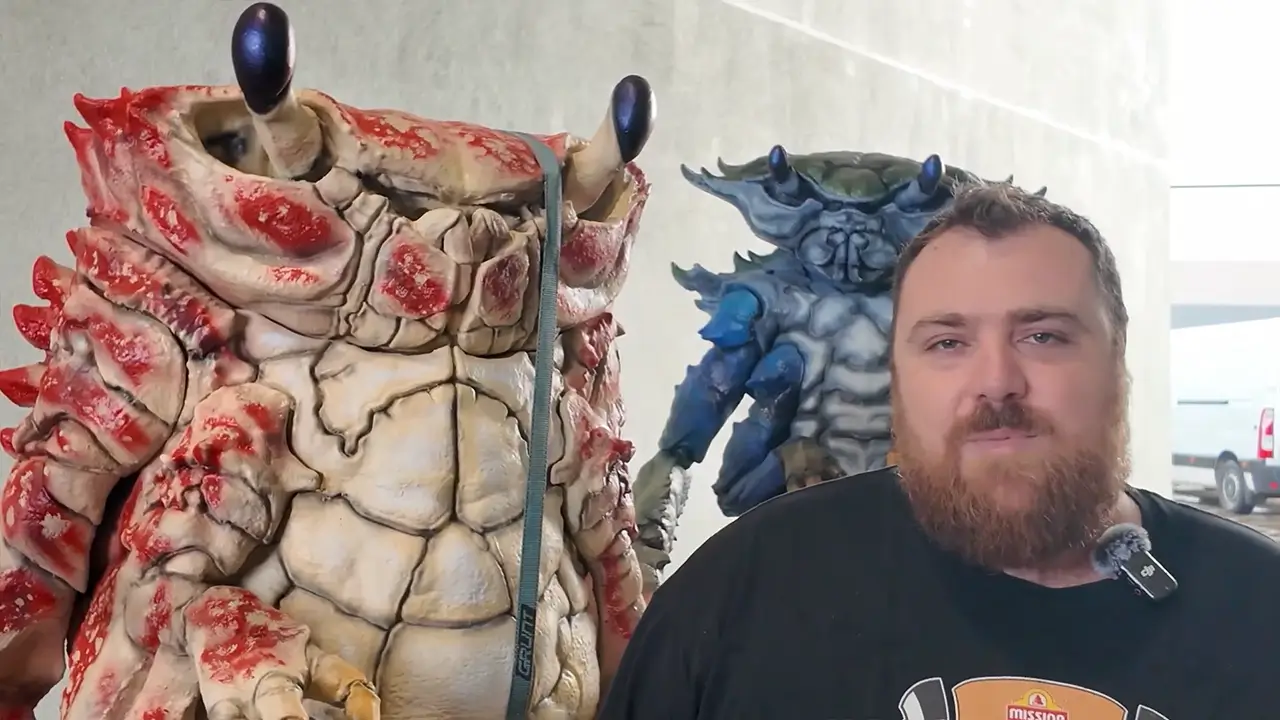 Zakariah Martin-Taylor standing with artwork