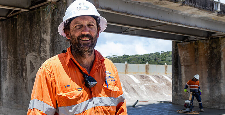 Caption: CivilPlus Construction’s Karl Kratzmann watches as the last protective concrete slab is poured for the Paluma Dam spillway upgrade. CivilPlus Construction’s Karl Kratzmann watches as the last protective concrete slab is poured for the Paluma Dam spillway upgrade