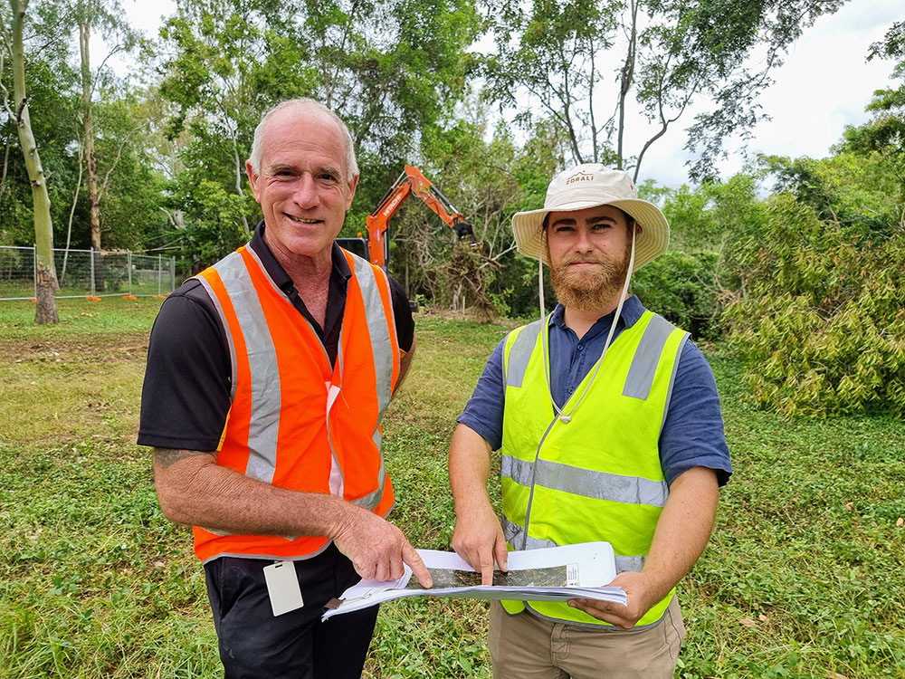 Cr Maurie Soars and Townsville City Council Sustainability Risk Officer Tyson Schmidt look over the plans to restore and improve the riverbank near Ross Park at Kelso following the severe flooding event in 2019.