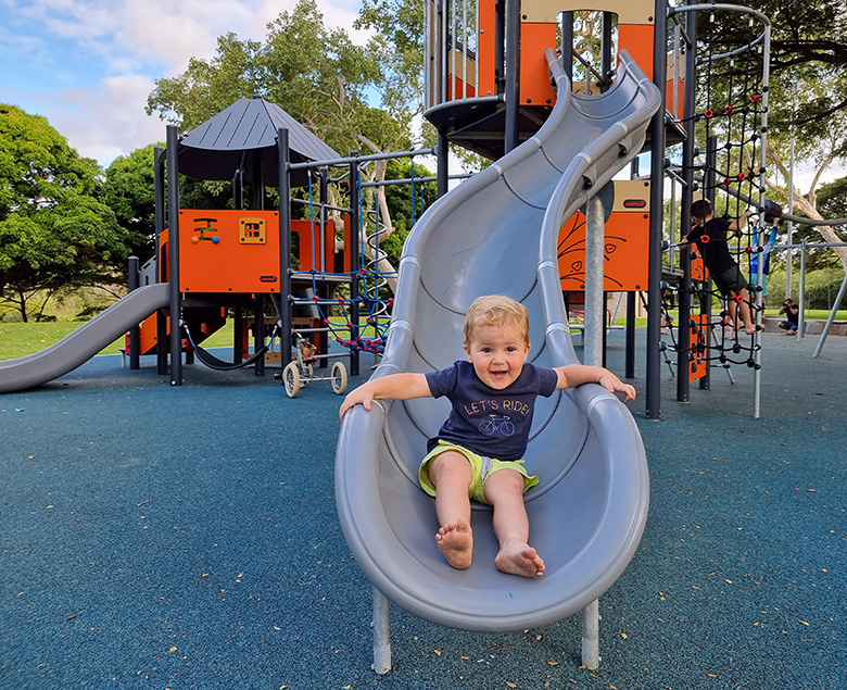 Caption: Two-year-old Nate Johnson enjoys the newly upgraded Bluewater Park playground. Two-year-old Nate Johnson enjoys the newly upgraded Bluewater Park playground