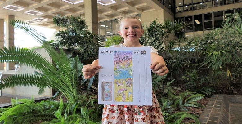 Ivy Cox, 9, with her winning design. Ivy Cox, 9, with her winning design.