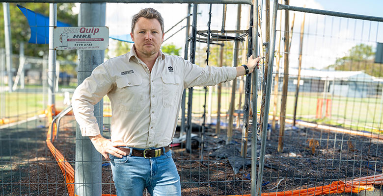Divisional Councillor, Brady Ellis with the burnt playground Divisional Councillor, Brady Ellis with the burnt playground