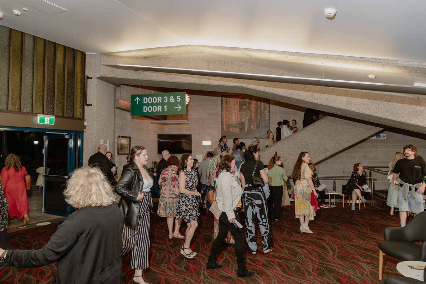 People standing in the lobby of Townsville Civic Theatre