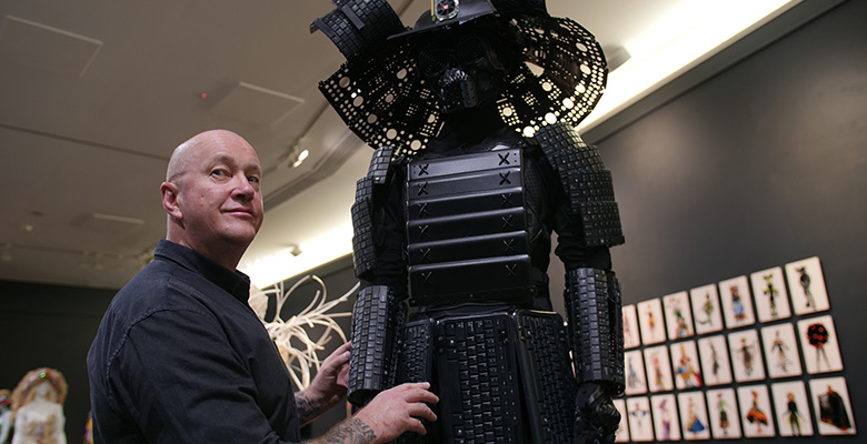 Artist Rob Douma with his piece from the Wearable Art Creatives exhibition UP CLOSE.