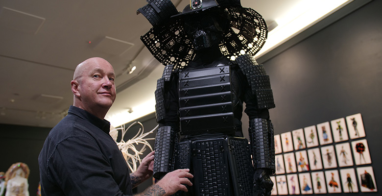 Artist Rob Douma with his piece from the Wearable Art Creatives exhibition UP CLOSE. Artist Rob Douma with his piece from the Wearable Art Creatives exhibition UP CLOSE.