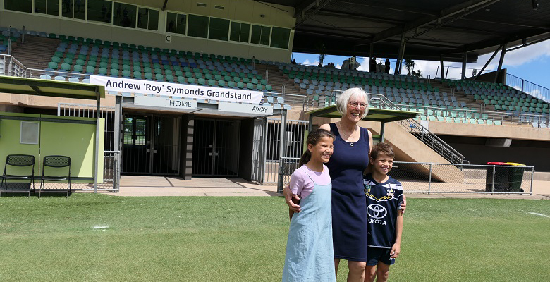 Photograph of Chloe, Barbara and Will Symonds unveiling the new Andrew 'Roy' Symonds Grandstand at Riverway Stadium.