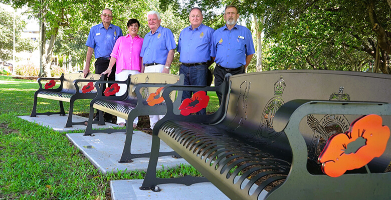 Acting Mayor Ann-Maree Greaney and North Queensland TPI Association members standing behind new park benches Acting Mayor Ann-Maree Greaney and North Queensland TPI Association members standing behind new park benches