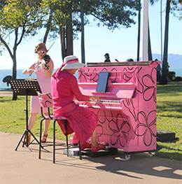 Jan Hynes playing on a pink piano