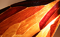 John Nesirky, Memory of sound [detail] 2024, Timber veneers and resin composite, 100 x 35 cm. Image courtesy of Townsville City Galleries.