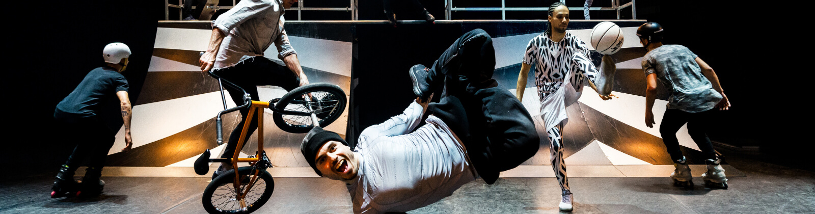 Men with bikes, rollerblades and a basketball freestyling