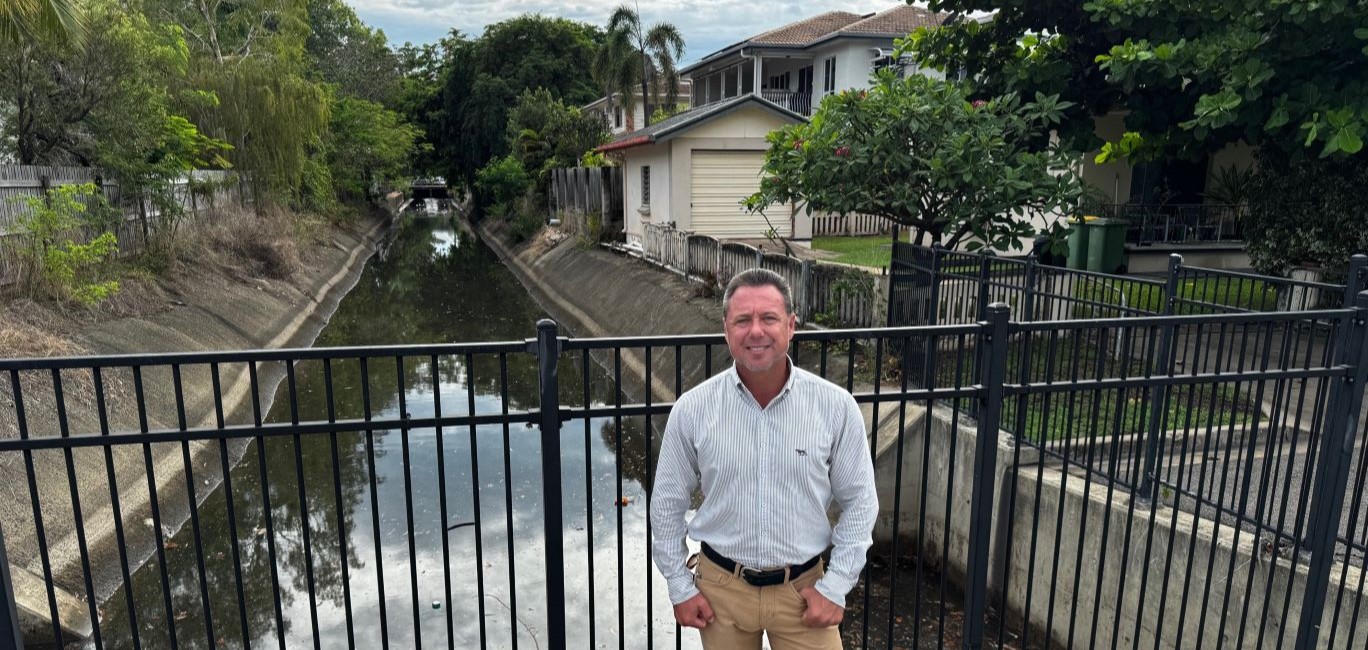 Townsville Mayor Nick Dametto in front of a drain on Ryan Street at Belgian Gardens.