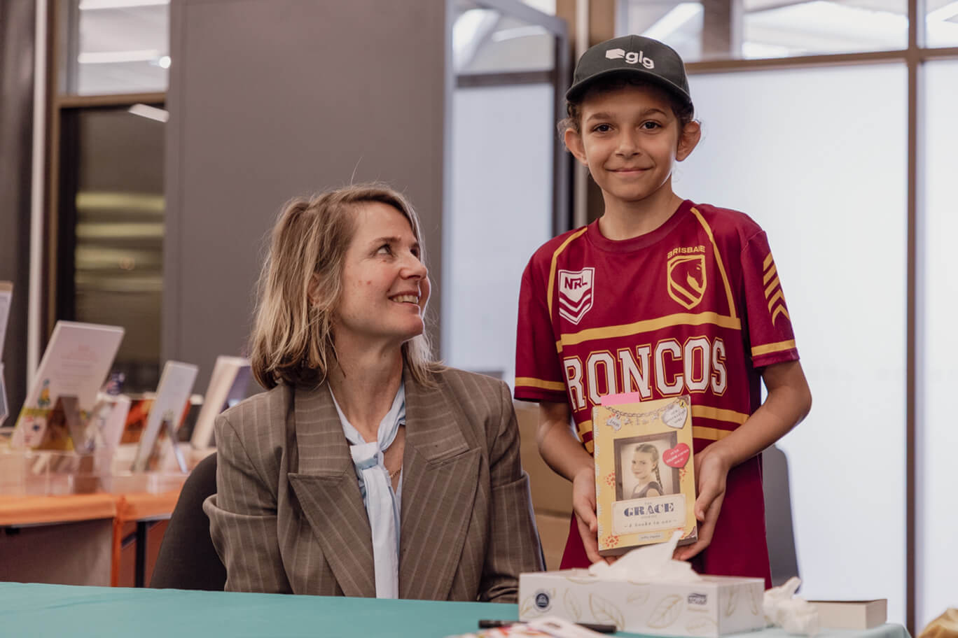 Fan posing with author Sofie Laguna at Festival of Stories 2026