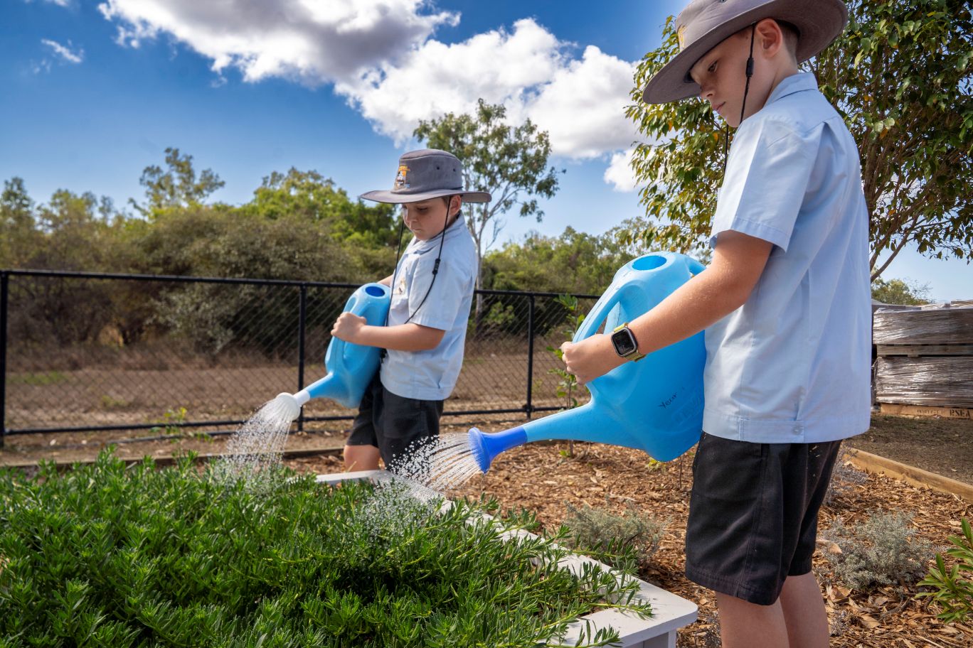 Students Cody Bamblett and Ryan Clark particularly enjoy watering their plants each day