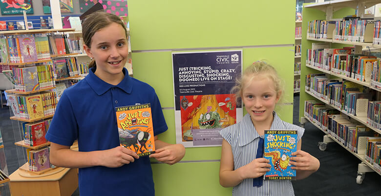 Local kids Sophie and Lucy Rehbein with Andy Griffiths books