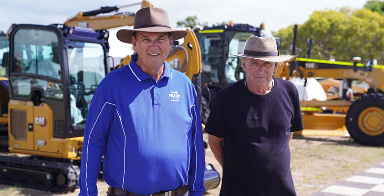 Rotary’s Ken Mackney (blue shirt) and Ray Macguire preparing for NQ Field Days.