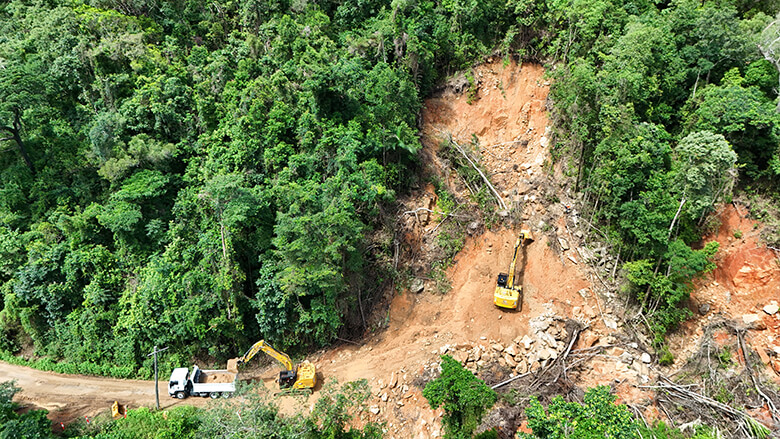 Construction crews shifting landslide debris Construction crews shifting landslide debris
