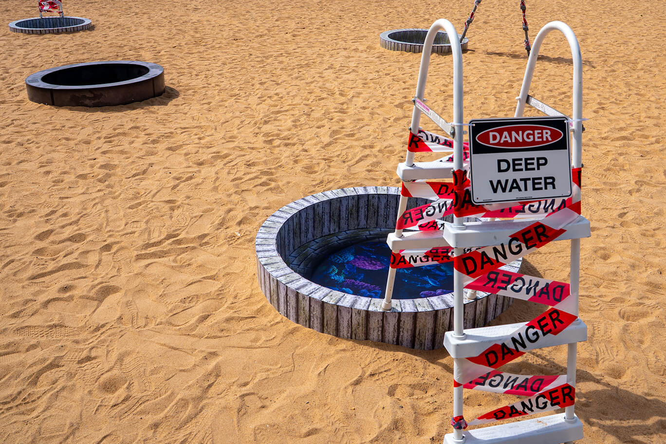 Circular pool with images of disappeared worlds