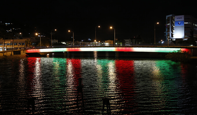Victoria Bridge lit in red, white and green