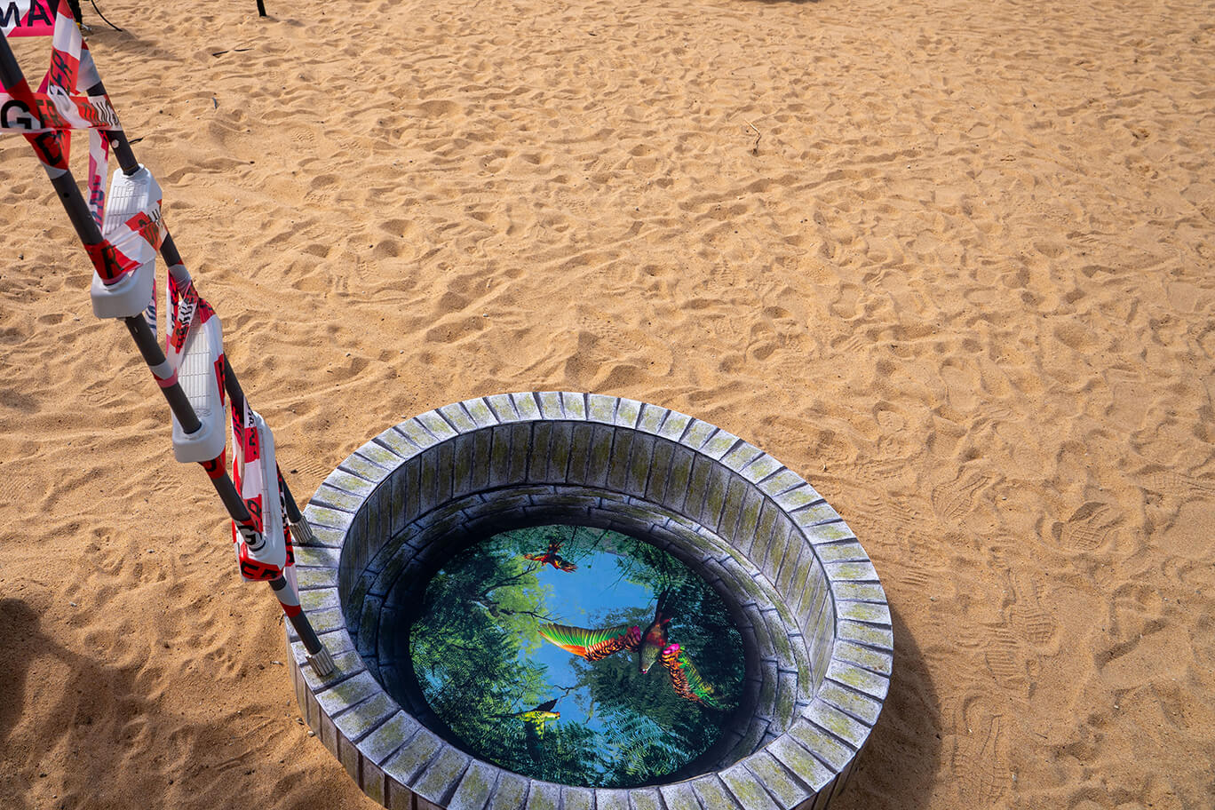 Circular pool with images of disappeared worlds