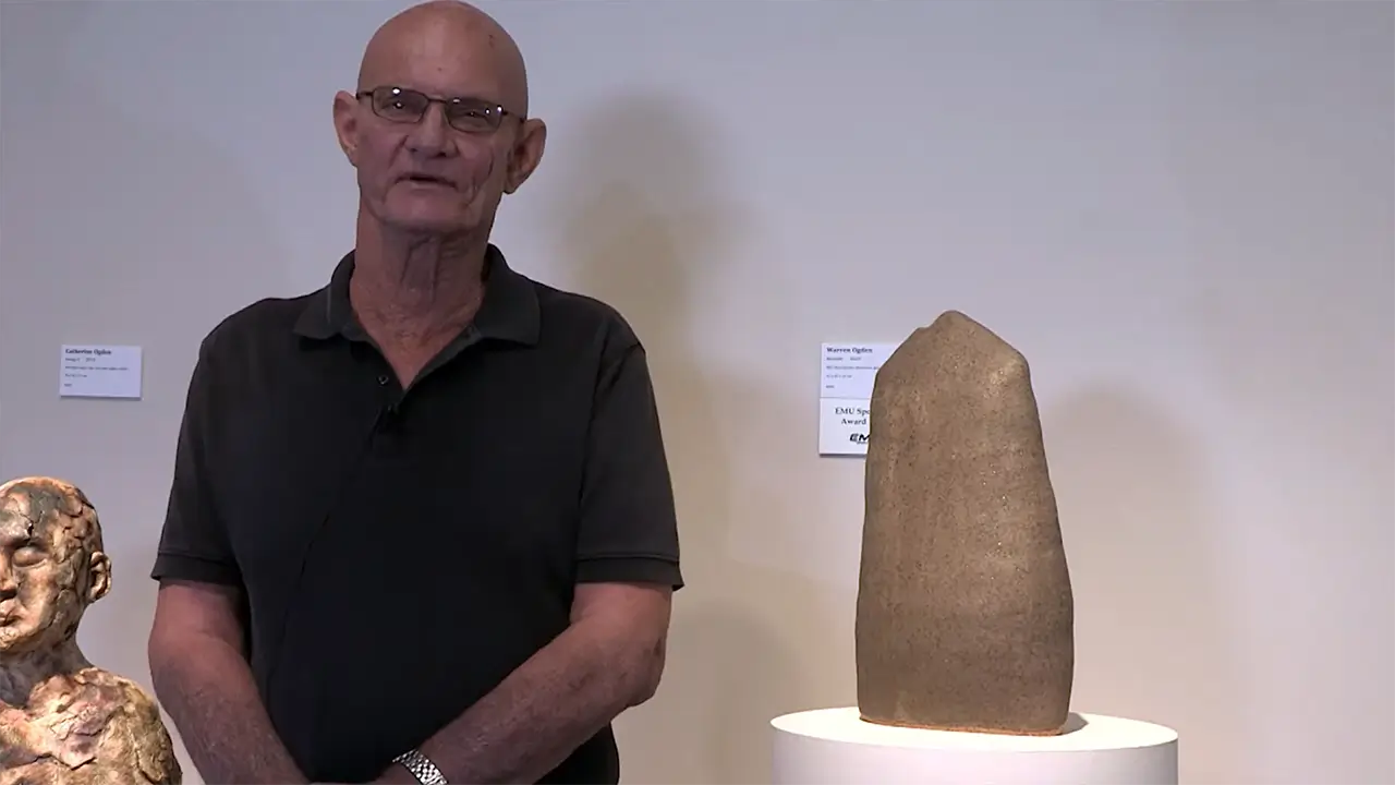 Warren Ogden with his artwork