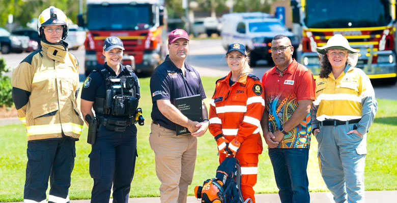Emergency Services personnel and Townsville Local Disaster Management Group Chair Andrew Robinson Emergency Services personnel and Townsville Local Disaster Management Group Chair Andrew Robinson