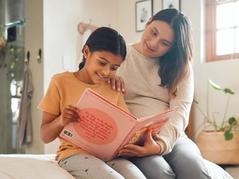 A mother and daughter reading in their language together