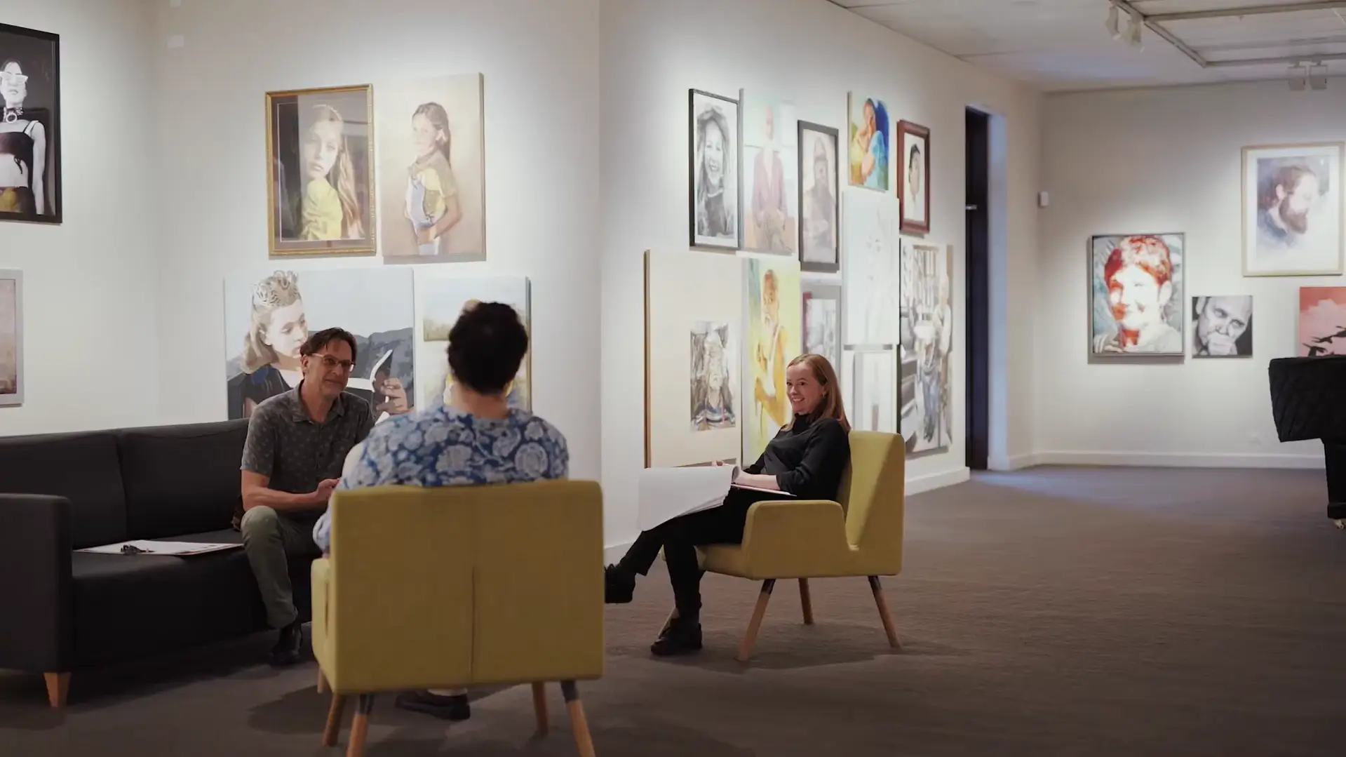 Judges discussing artwork