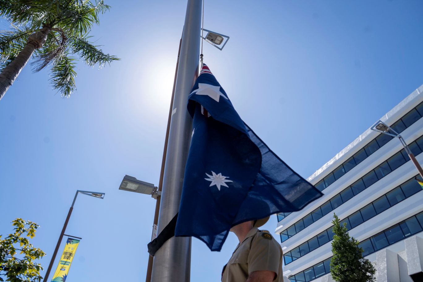 The Australian flag about to be raised along Flinders Street today