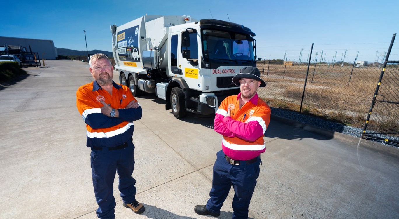 Leading hand waste and recycling truck driver Chris Dunn and waste and recycling truck driver Cameron Chisholm with one of the new AI-equipped trucks.
