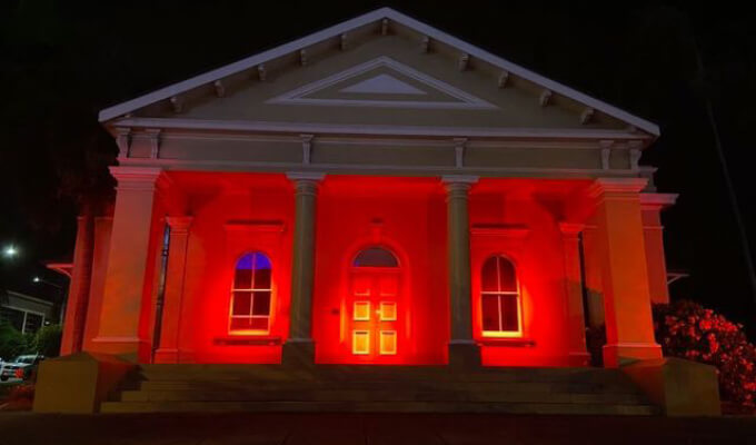 Old Magistrates Court lit up in red