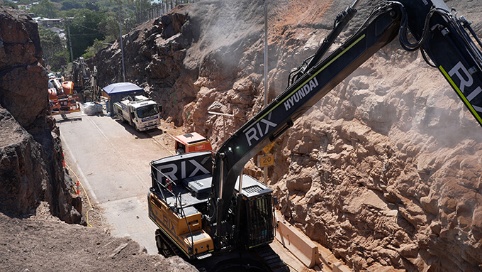 Excavator working on slope